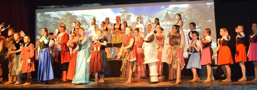 Arts and Theater Camp 2021 A variety of actors in costumer on stage performing.